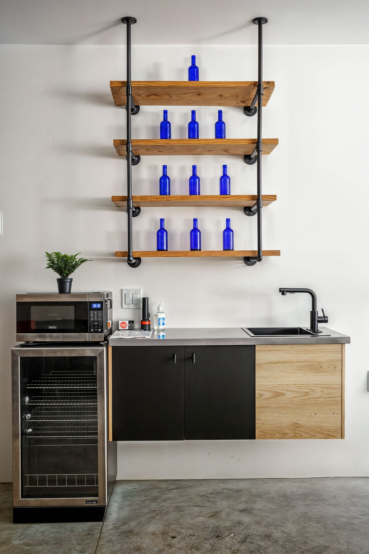 Wet bar with open shelving and wine fridge