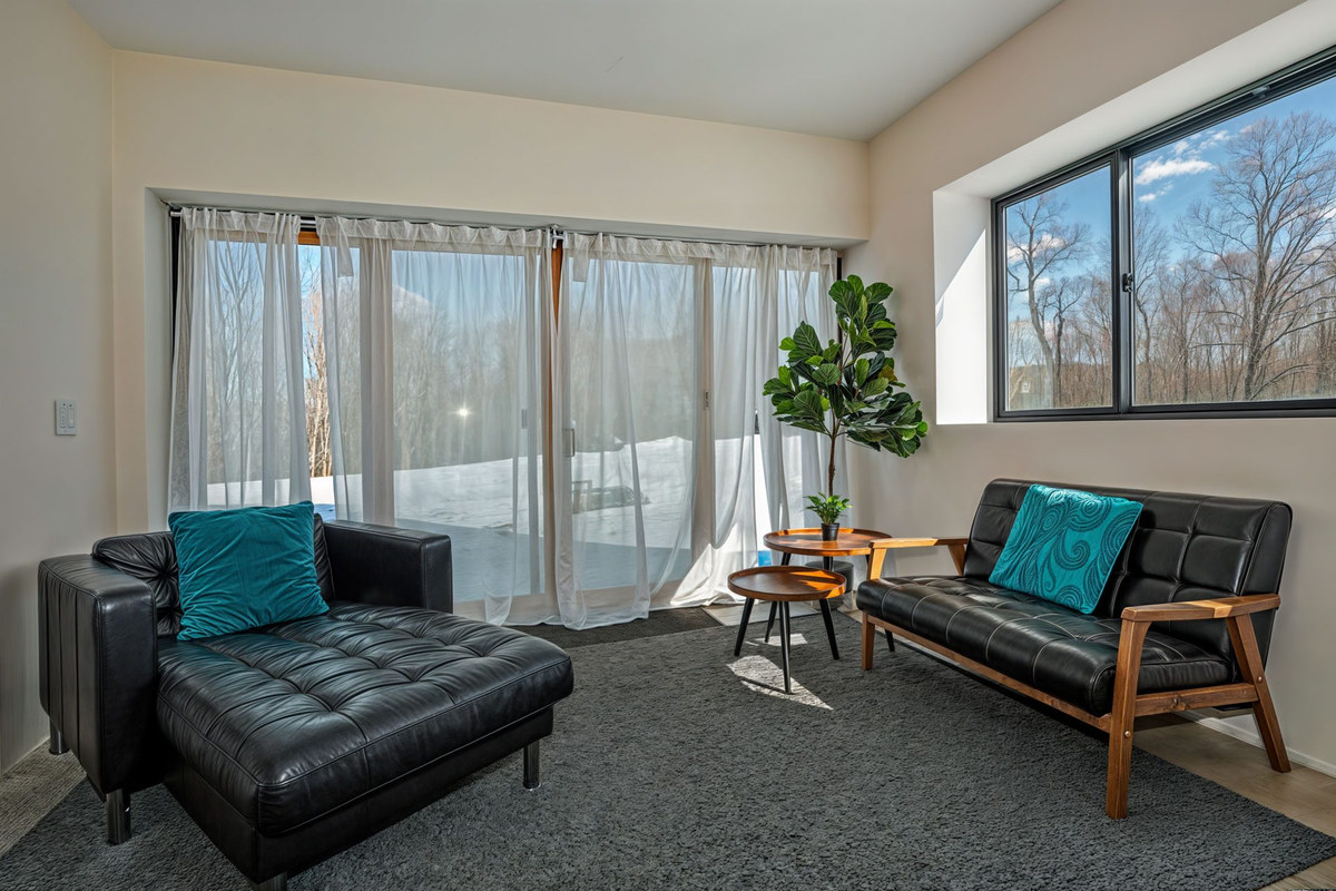 Lounge by the patio doors to the back of the property