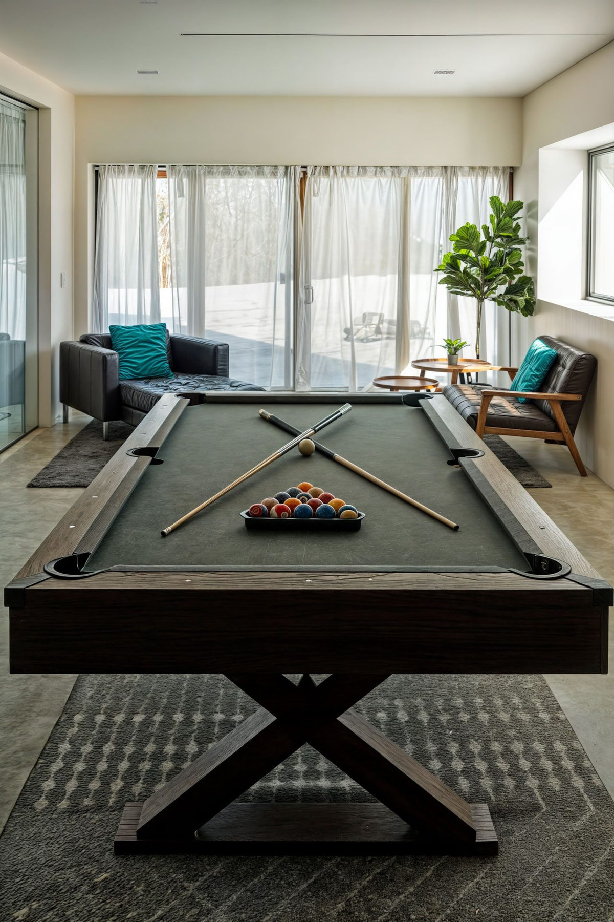Pool table with the lounge and patio doors beyond