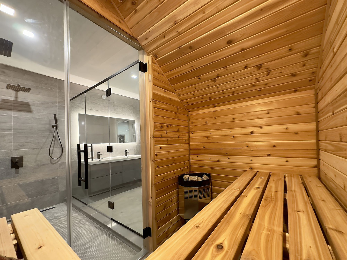 Cedar sauna with slatted benches and warm light